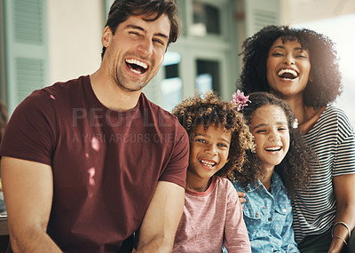 Buy stock photo Portrait of a beautiful young family posing together at home