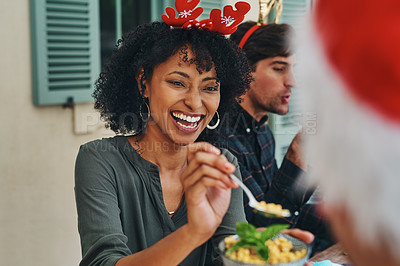 Buy stock photo Shot of beautiful young woman enjoying herself at Christmas lunch party with friends and family