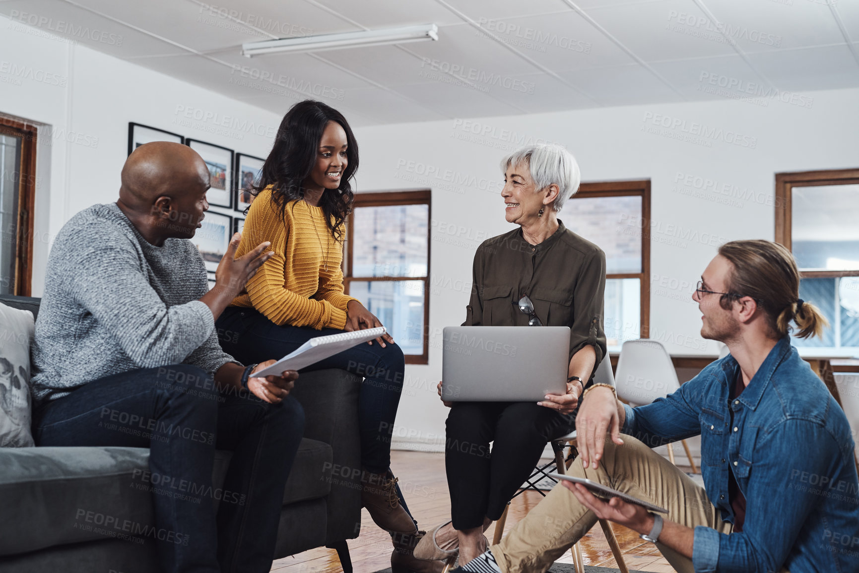 Buy stock photo Meeting, laptop and business people in office for conversation, project development or teamwork. Discussion, diversity and staff with paperwork for collaboration, planning or review at travel agency