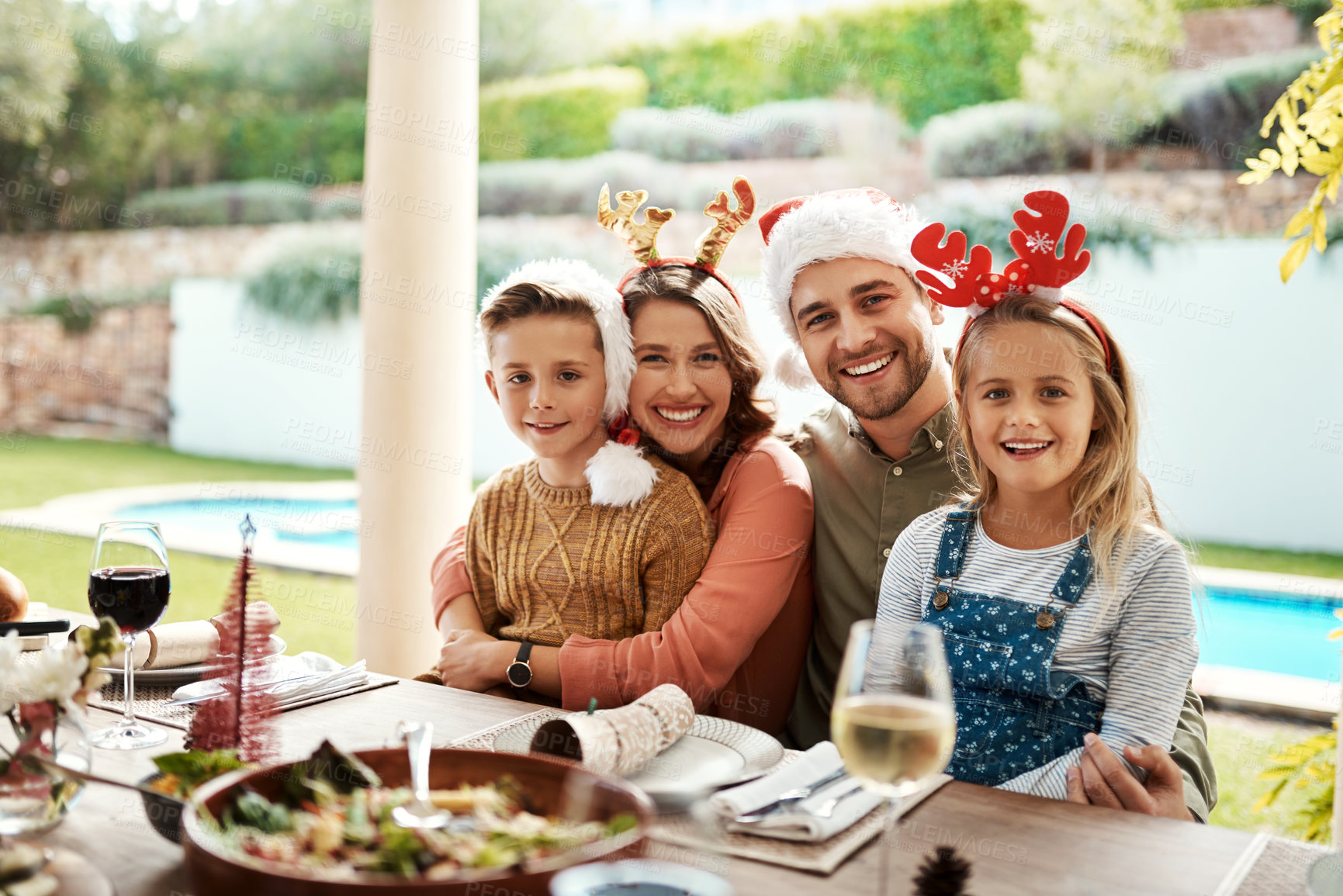 Buy stock photo Family, portrait and hug for Christmas, happiness and lunch outdoor with food, smile and pool in backyard. Mom, dad and children for holiday, celebration and brunch with support, bonding and embrace