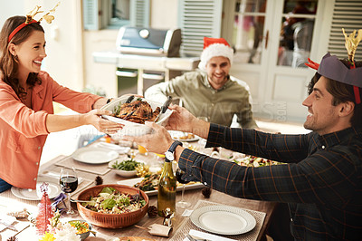 Buy stock photo Cropped shot of people enjoying Christmas lunch together