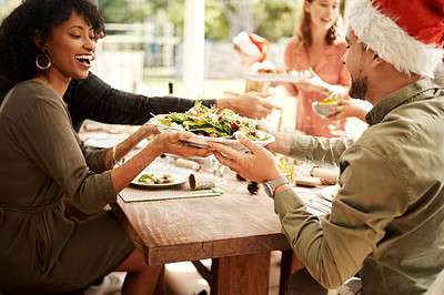 Buy stock photo Cropped shot of people enjoying Christmas lunch together
