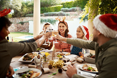 Buy stock photo Cropped shot of a family making a toast on Christmas day