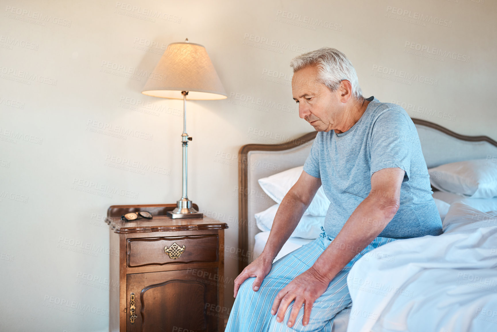 Buy stock photo Bedroom, thinking and senior man with retirement, morning and relax with memory, nostalgia and sad. House, pensioner and elderly man on bed, start day and depression with mental health and lonely