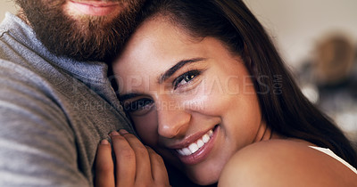 Buy stock photo Shot of an affectionate young couple sharing a romantic moment at home