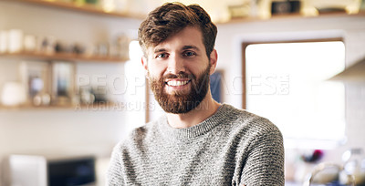 Buy stock photo Shot of a handsome young man spending a relaxing day at home