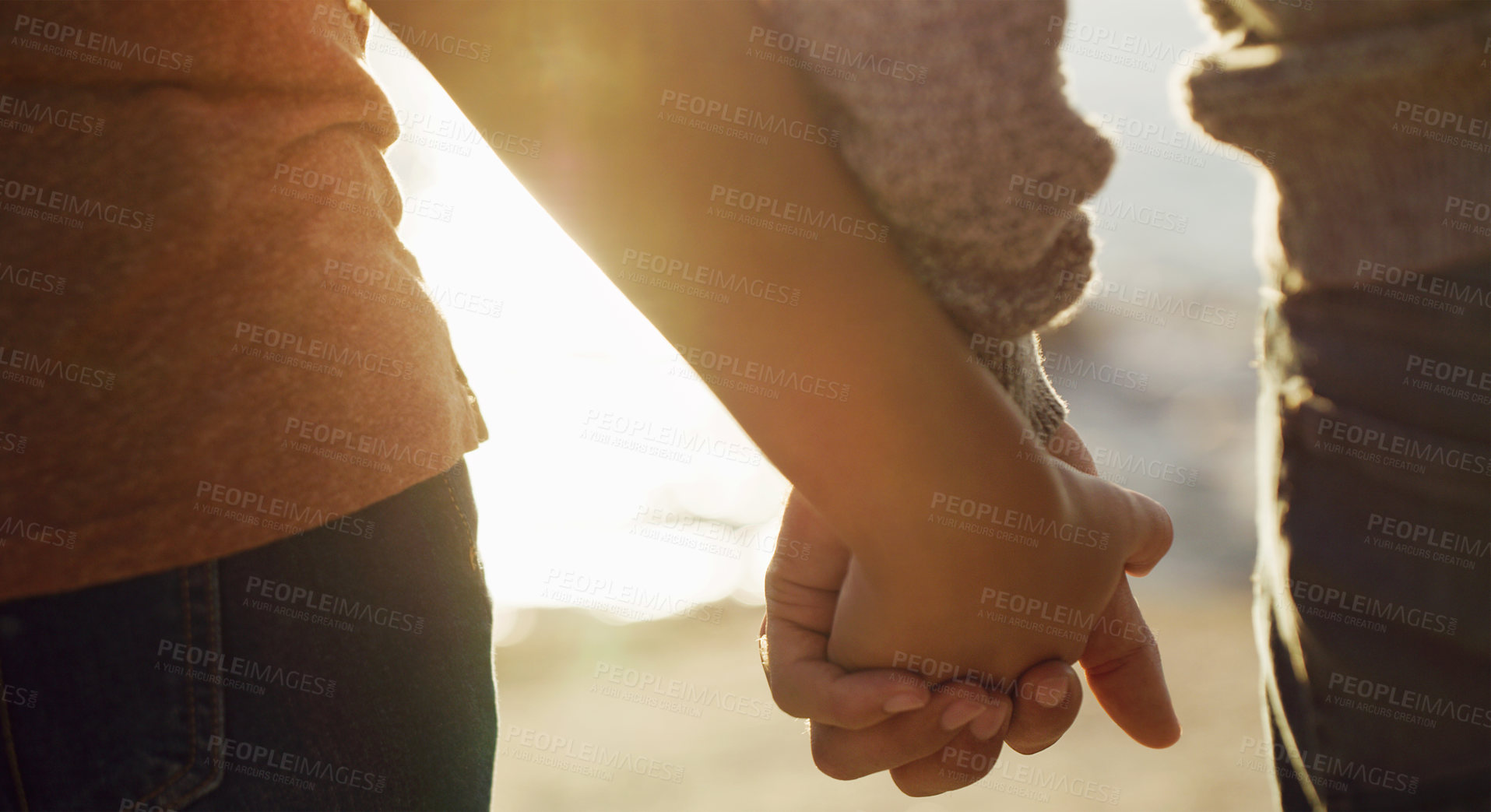 Buy stock photo Cropped shot of an unrecognizable couple holding hands
