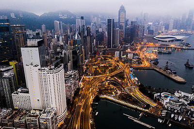 Buy stock photo Aerial shot of skyscrapers, office blocks and other commercial buildings in the urban metropolis of Hong Kong