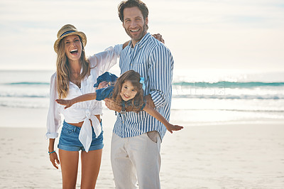 Buy stock photo Playing, beach and portrait of child with parents for holiday, vacation and weekend by ocean. Family, happy and girl, mother and father for airplane games for bonding, playful relationship and fun