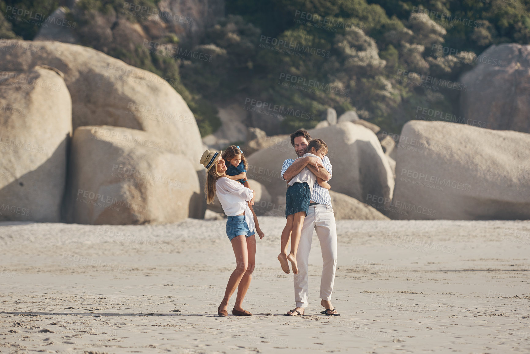 Buy stock photo Travel, family and play on beach with love on summer vacation, journey and bonding for childhood memories. Mom, dad and together with children on sand for fun, holiday and seaside adventure with joy.