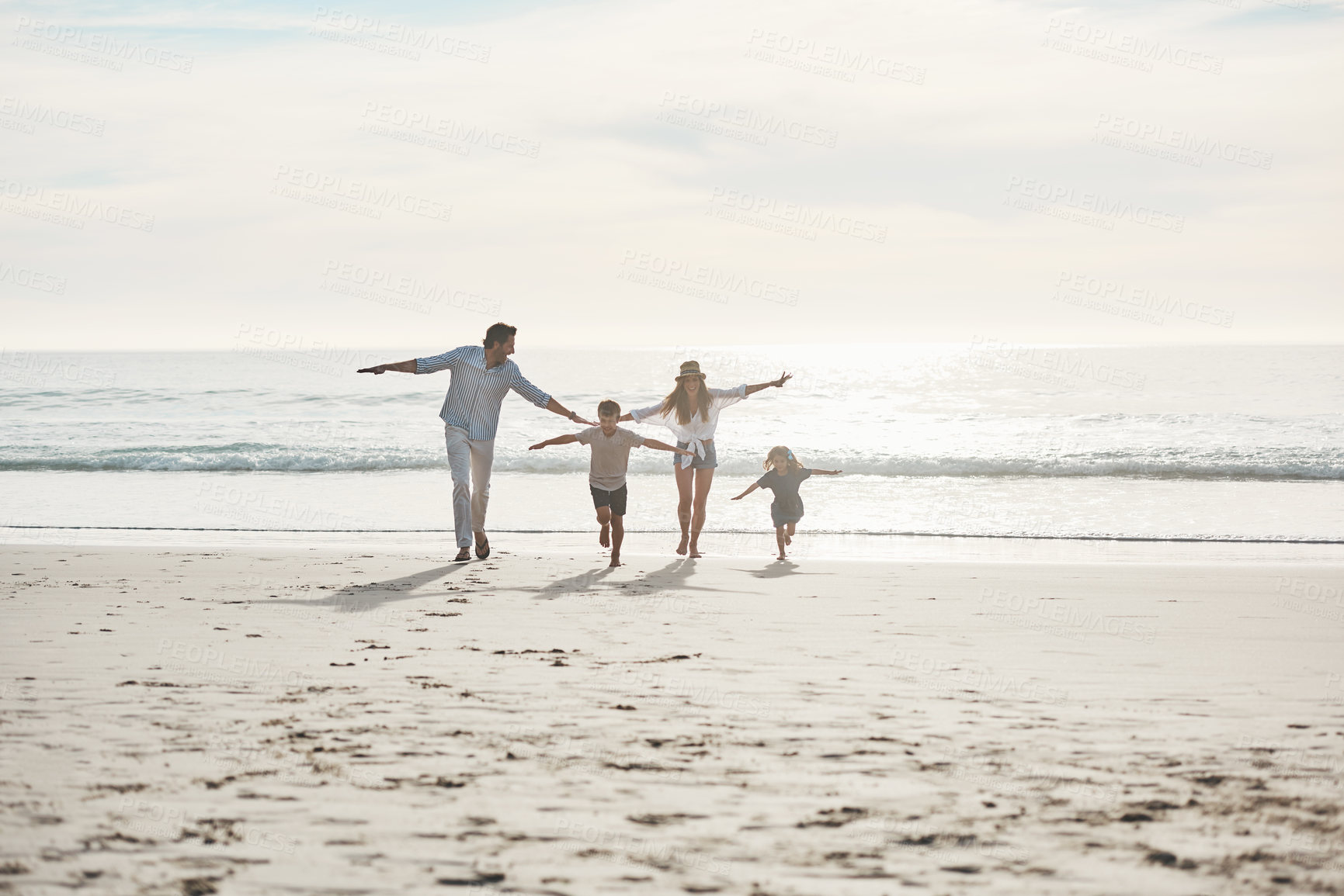 Buy stock photo Beach, run and airplane with parents play, freedom and happy adventure by ocean on sky. Flying, game and children running with family in Miami shore for holiday travel, trip and summer vacation