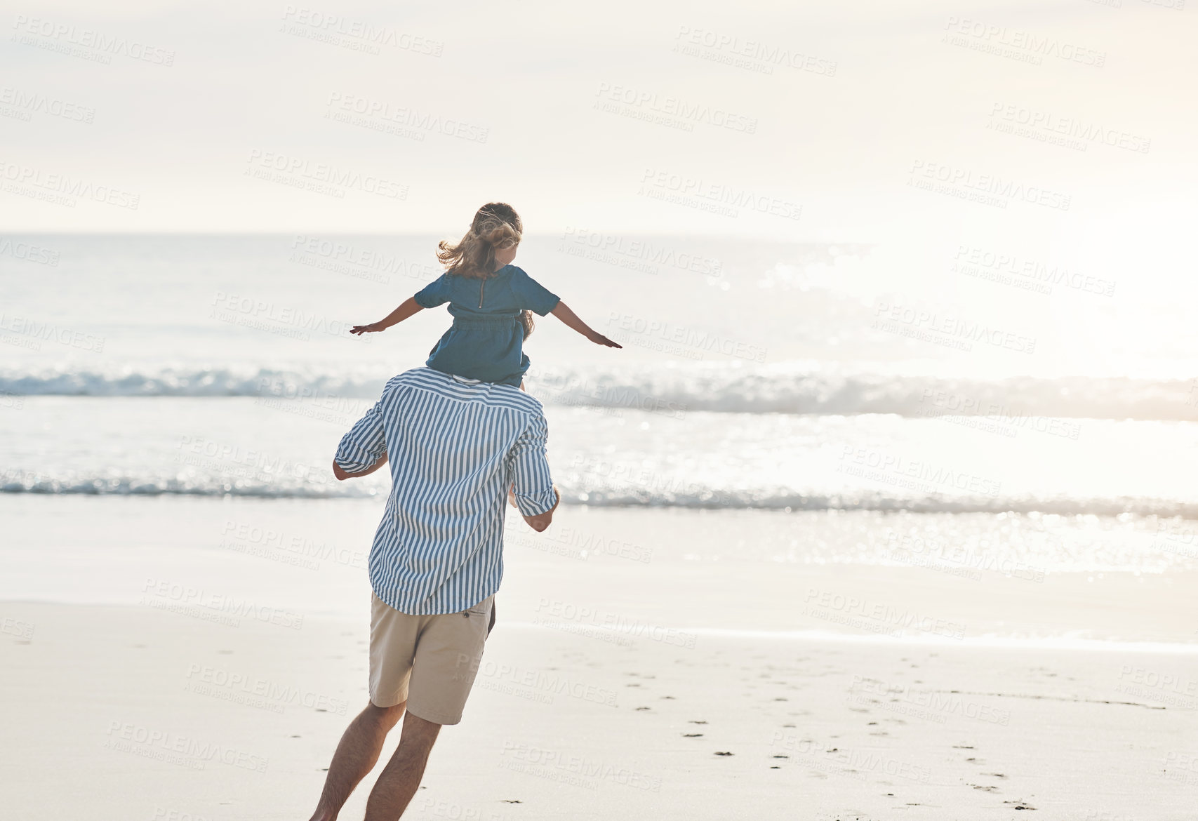 Buy stock photo Beach, airplane and father with girl playing, on shoulders and happy adventure by ocean on blue sky. Flying, game and daughter run with dad in Miami shore for holiday travel, trip and summer vacation