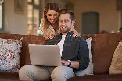 Buy stock photo Relax, laptop and web with a couple on the living room sofa of their home together. Computer, social media or internet with a man and woman online to search while relaxing and bonding in a house