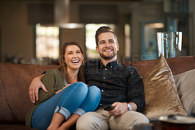Buy stock photo Happy couple, smile and hug on sofa for movie, care or in love for relationship and dating on weekend in home. Man, woman and cheerful in house for bond, affection or loving for watching tv or unwind