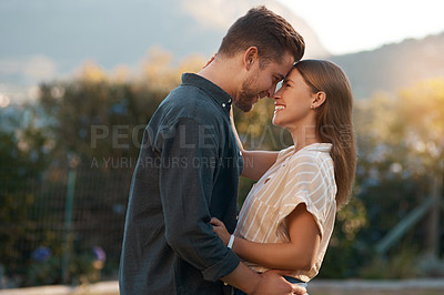 Buy stock photo Shot of an affectionate couple spending the day outdoors