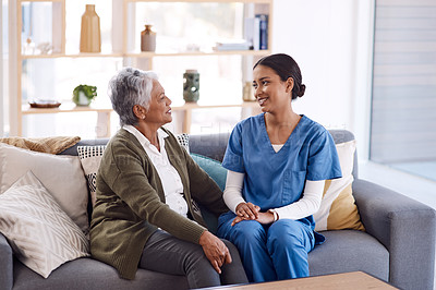 Buy stock photo Healthcare, retirement and a nurse talking to an old woman on a sofa in the living room of a nursing home. Medical, trust and care with a female medicine professional chatting to a senior resident
