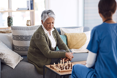 Buy stock photo Nurse, chess or old woman in nursing home for healthcare, problem solving skills or mental health recovery. Relaxing, caregiver or focused mature patient thinking of solution or playing board games 