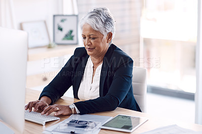 Buy stock photo Busy, computer and management with a business woman or CEO working in her corporate office. Mission, professional and leadership with a senior female manager at work typing an email or proposal