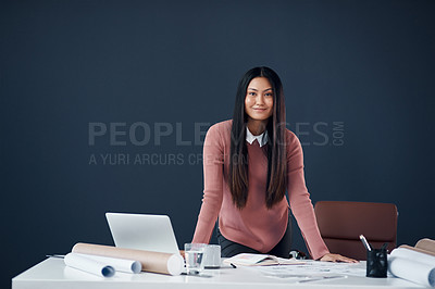 Buy stock photo Portrait of an attractive young female architect working in her office
