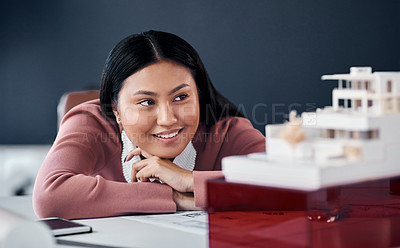 Buy stock photo Woman, architect and thinking by model for design in office with ideas, progress and inspiration for solution. Person, engineer and property developer by building, house or smile at agency in Jakarta