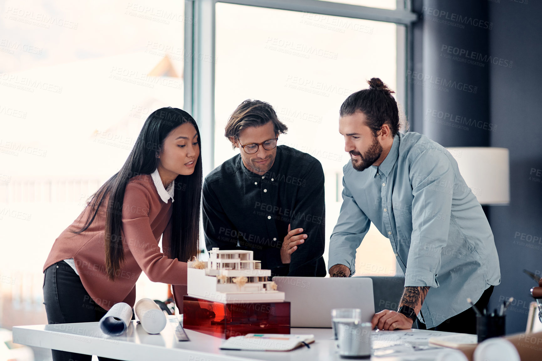 Buy stock photo Architect, meeting and discussion with laptop for construction design, teamwork or planning at office. Group of creative employees or civil engineers brainstorming on computer for building or startup