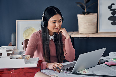 Buy stock photo Architect, woman and headphones with laptop in workplace for construction, thinking and music for inspiration. Person, property developer and audio streaming with idea, vision and review in Jakarta