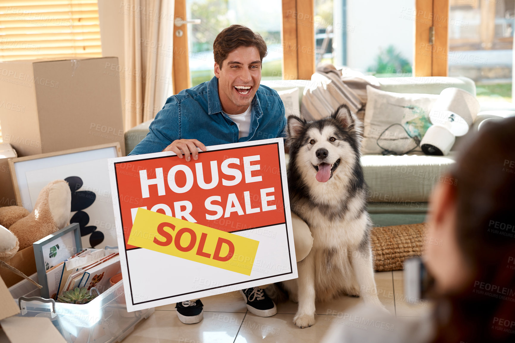 Buy stock photo Couple, dog or happy family with house sold for moving into new home, investment and relocation together. Real estate, bond and celebration with people and pet in living room for property sale sign