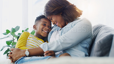 Buy stock photo Shot of a young mother bonding and spending time with her adorable little boy at home