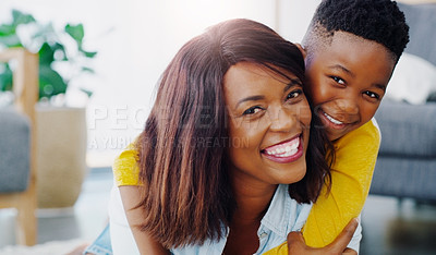 Buy stock photo Portrait of a young mother bonding and spending time with her adorable little boy at home