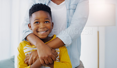 Buy stock photo Portrait of an adorable little boy bonding and spending time with his mother at home
