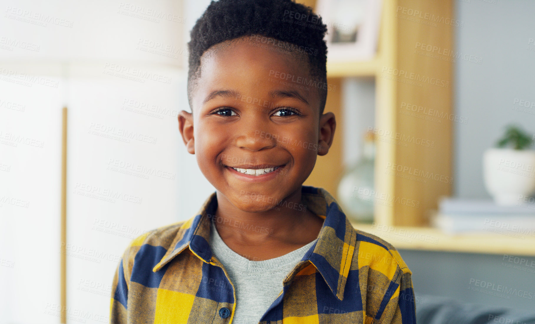 Buy stock photo Portrait of an adorable little boy smiling and feeling cheerful at home