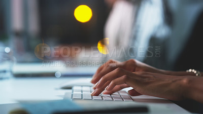 Buy stock photo Cropped shot of an unrecognizable businesswoman working late at night in the office