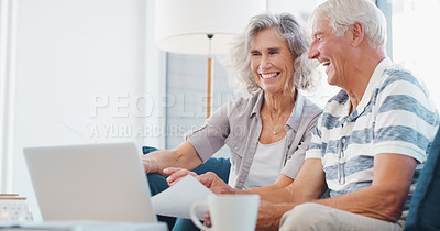 Buy stock photo Shot of a senior couple going through paperwork on the sofa at home
