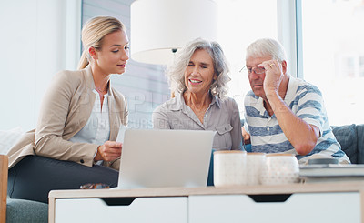 Buy stock photo Shot of a senior couple meeting with a consultant to discuss paperwork at home