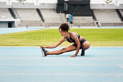 Buy stock photo Woman, fitness and stretching body on stadium track for running, exercise or workout. Active female person or athlete in warm up leg stretch for sports training, athletics or cardio run outdoors