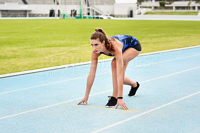 Buy stock photo Start position, race track and woman for running, exercise and workout for sport outdoor by grass or ready on arena. Stadium, runner and athlete for wellness and gym for cardio, training or health
