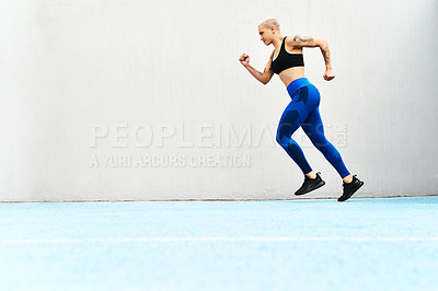 Buy stock photo Woman, running and training in stadium with cardio workout for race competition, fitness and marathon. Female athlete, outdoor exercise and speed at run track for health, strong body and sports event