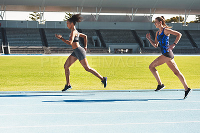 Buy stock photo Woman, running and stadium track of athletes in competition, fitness or athletics in the outdoors. Fit, active or sporty women, runner or sprinting in exercise, workout or training for healthy cardio