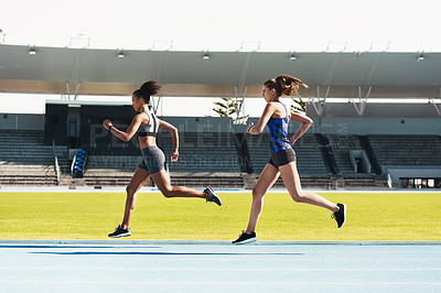Buy stock photo Woman, running and stadium track in competition, race or fitness for athletics in the outdoors. Fit, active or sporty women, runner or sprinting in exercise, workout or training for healthy cardio
