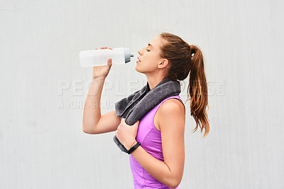 Buy stock photo Woman, athlete and drinking water in studio, relax and hydration after workout on white background. Female person, profile and mineral liquid for recovery after exercise, fitness and mockup space