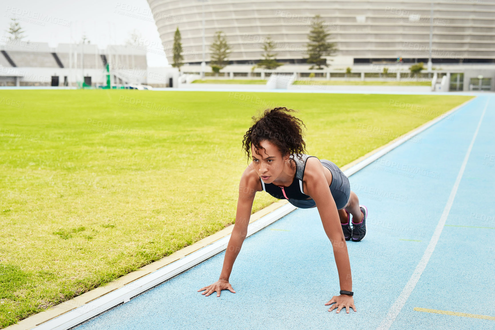 Buy stock photo Woman, athlete and doing push up in stadium for running, training and fitness in summer. Runner, challenge and workout on track field for wellness, cardio and warm up for sports or marathon.