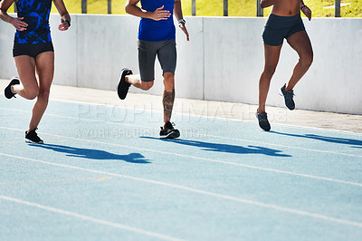 Buy stock photo People, legs and running on stadium track for athletics, fitness or exercise in training outdoors. Leg of athlete group in sports run competition, exercising or workout for healthy cardio wellness