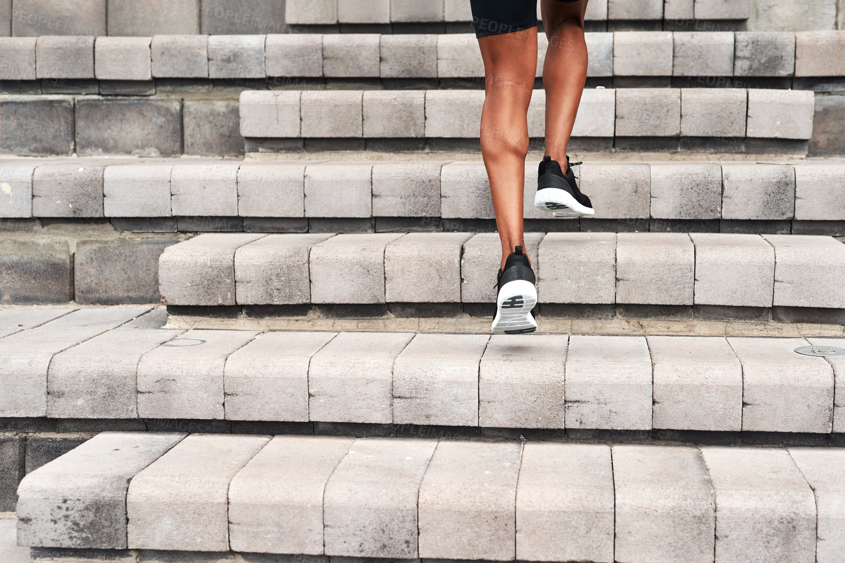 Buy stock photo Athlete, legs and running up stairs in city for fitness, workout and exercise in summer. Runner, behind person and outdoor on steps for sport, wellness and cardio training for marathon in New York
