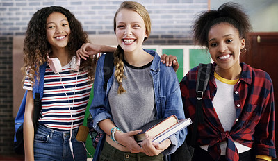 Buy stock photo Portrait of a group of cheerful young school kids standing together while waiting to go to class at school