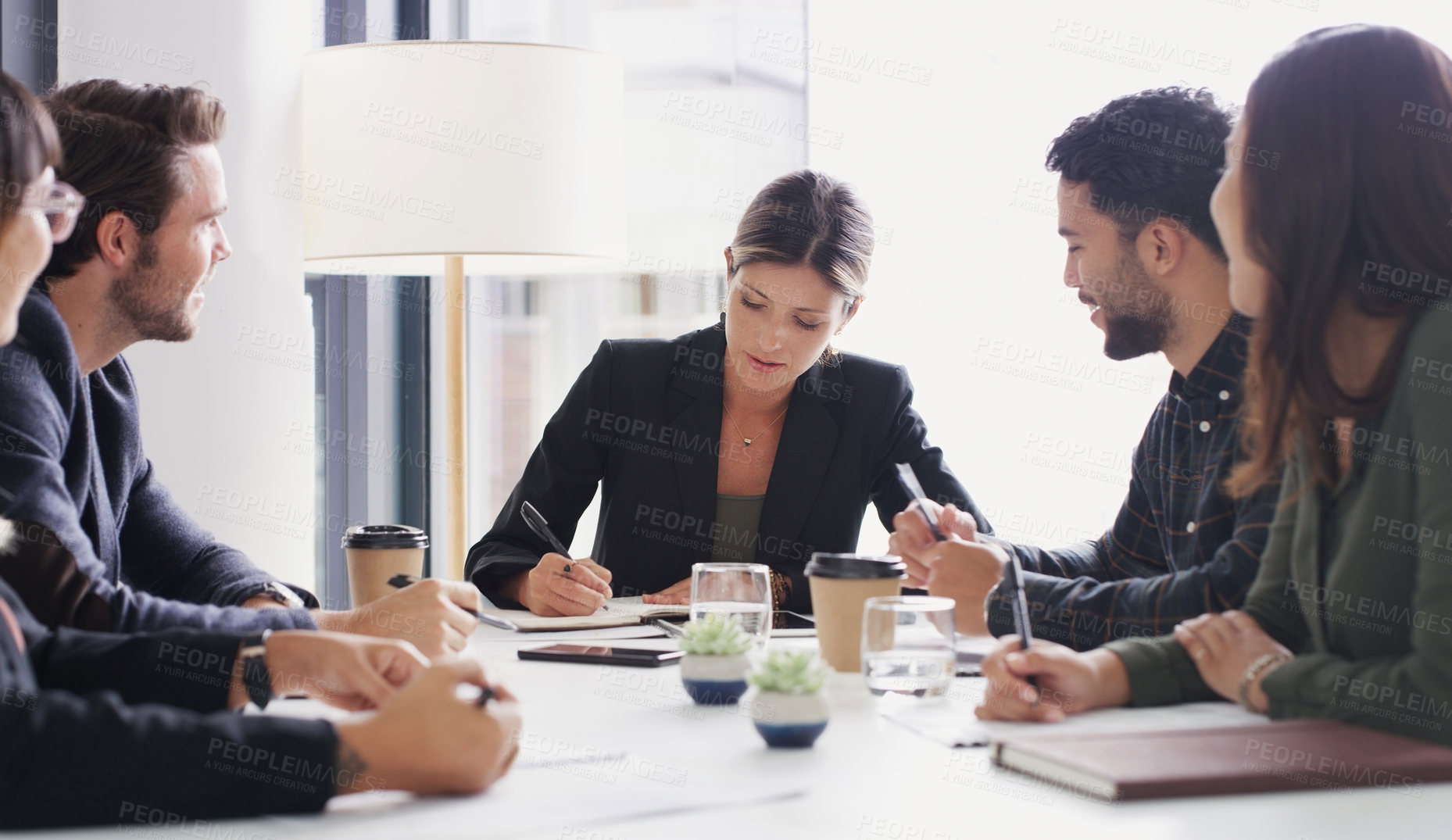 Buy stock photo Shot of a group of businesspeople having a meeting in a boardroom