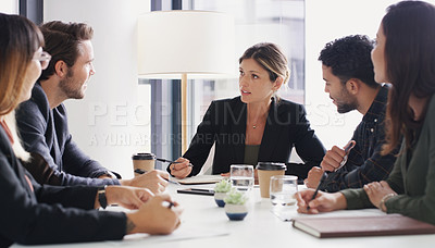 Buy stock photo Shot of a group of businesspeople having a meeting in a boardroom