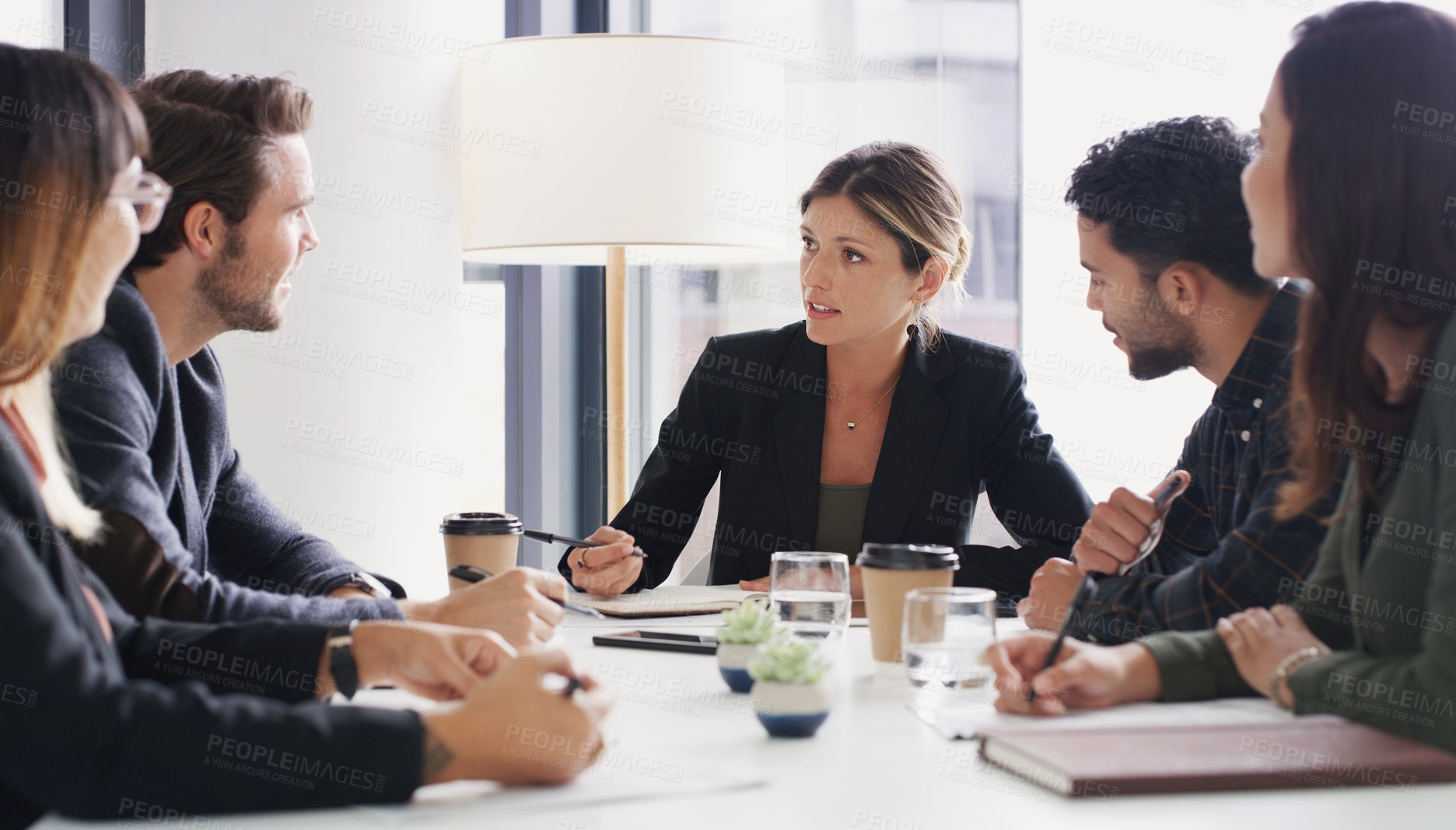 Buy stock photo Shot of a group of businesspeople having a meeting in a boardroom