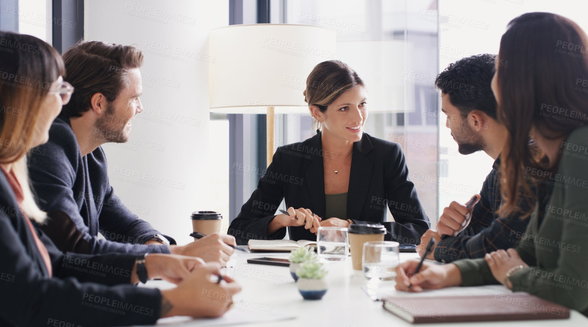 Buy stock photo Shot of a group of businesspeople having a meeting in a boardroom