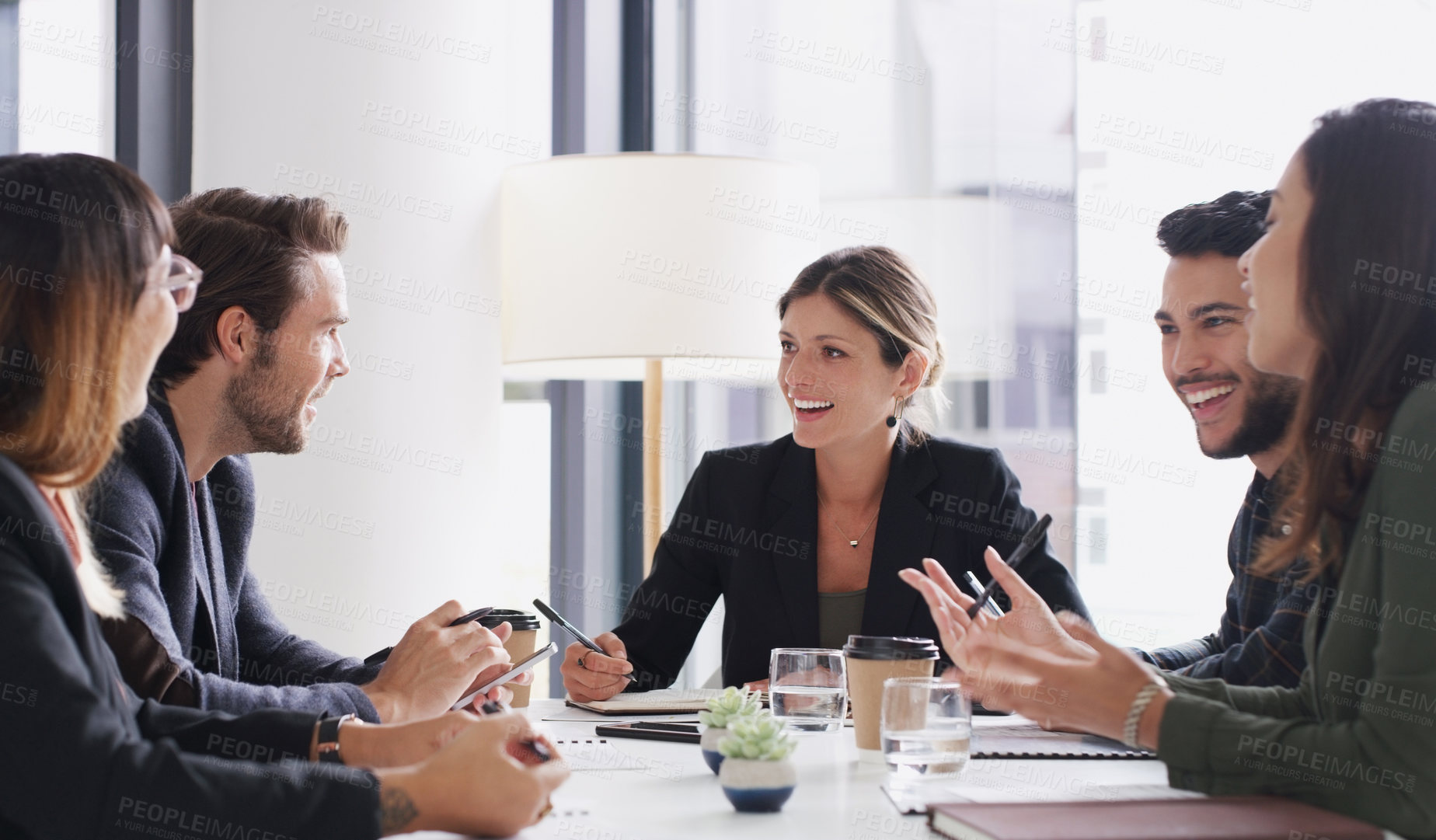 Buy stock photo Shot of a group of businesspeople having a meeting in a boardroom