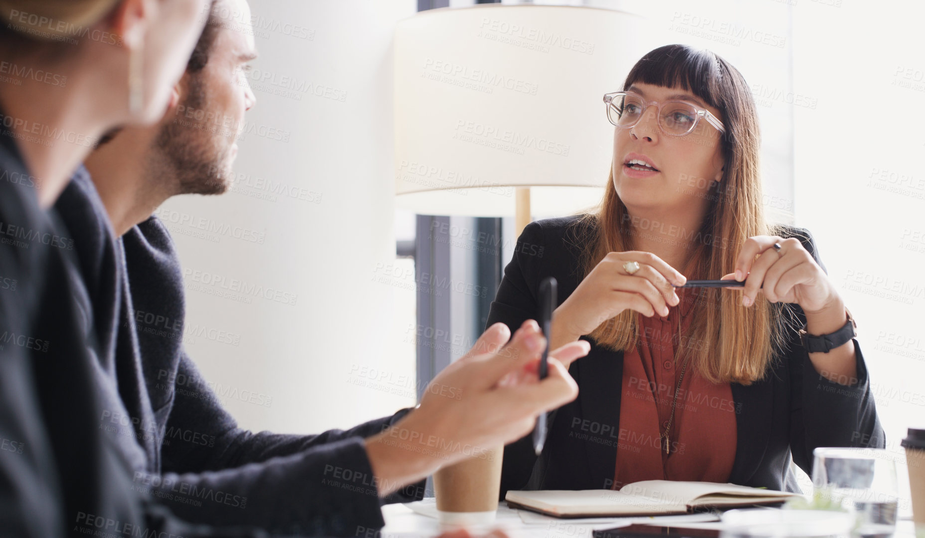 Buy stock photo Shot of a group of businesspeople having a meeting in a boardroom